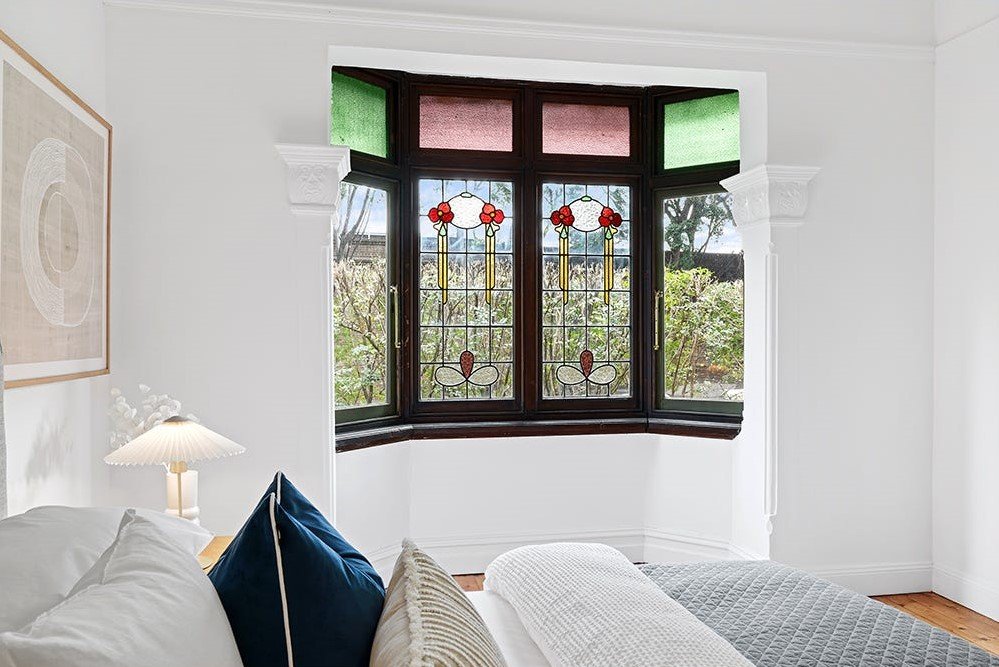 Marrickville heritage home restoration — stained-glass bay window, restored cornicing